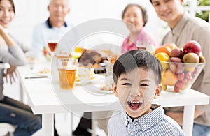 Asian family having dinnerÂ at home